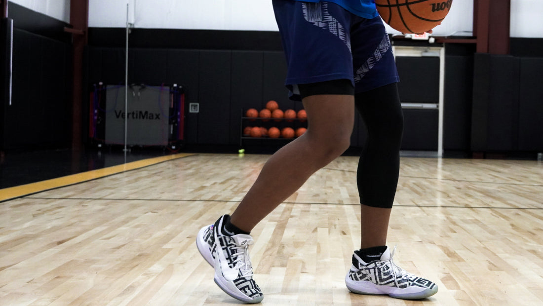 athlete wearing black lvls single leg tights